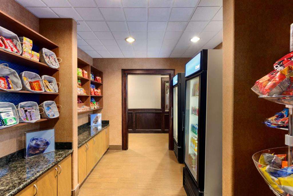Convenience shop with snack shelves and cold drinks coolers