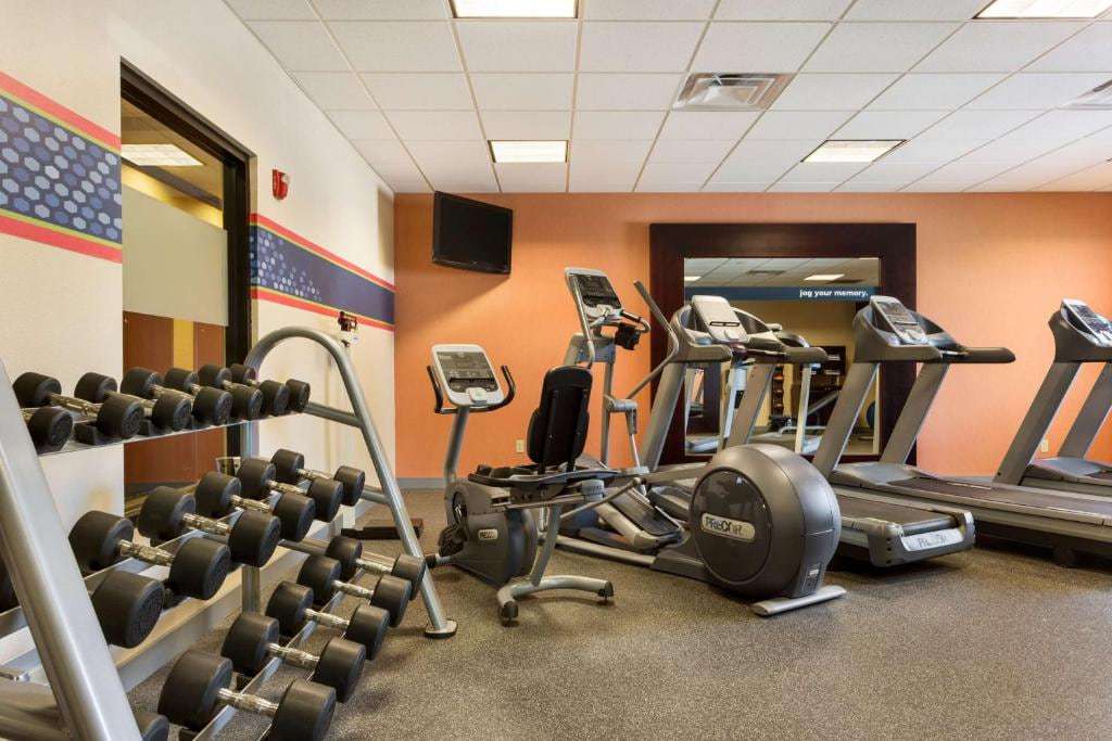 Fitness center with treadmills, elliptical, recumbent bike and dumbbell rack