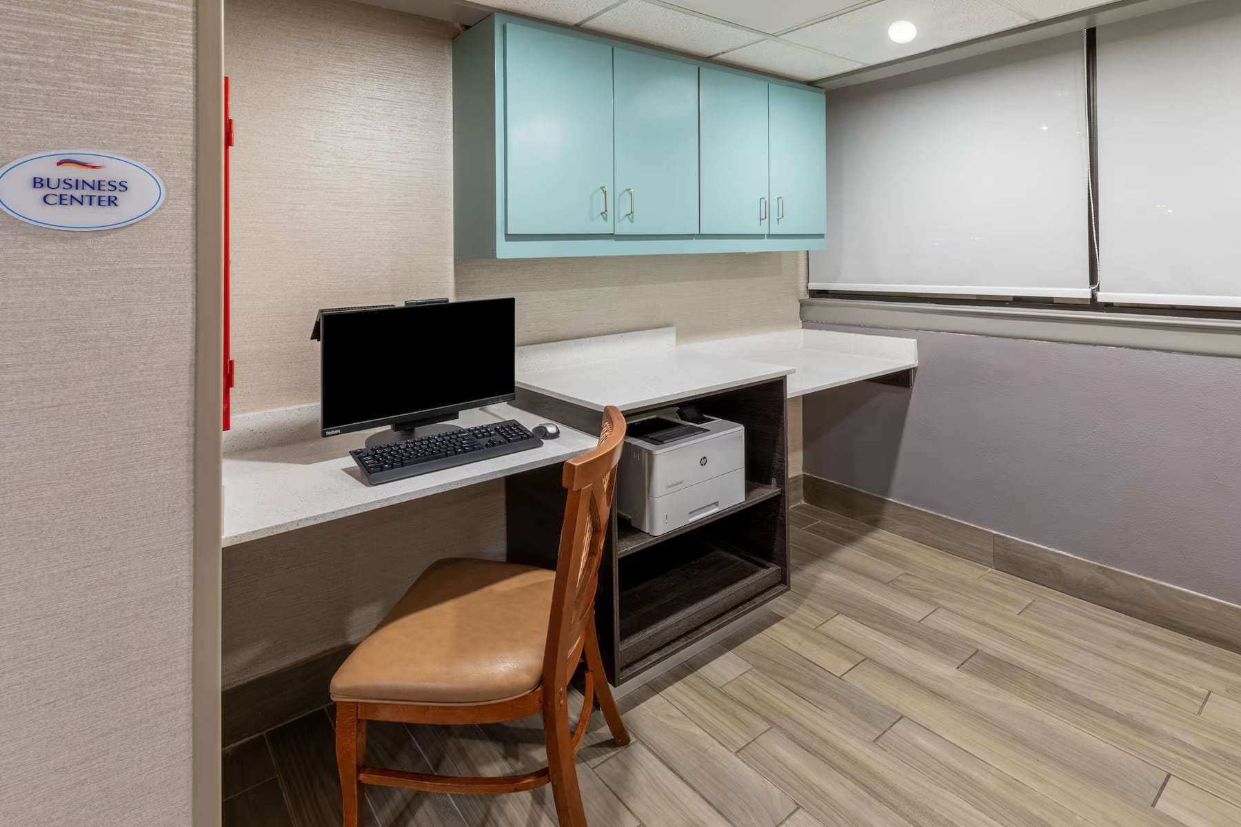 Business center with desktop computer and printer
