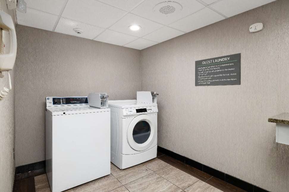 Guest laundry room with washer and dryer